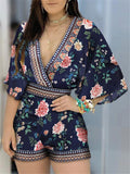 Fashionable Wrap Neck Fitted Waist Vibrant Floral Print Flare Sleeve Playsuit
